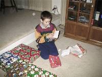 Colin actually stopping to read a card that came with a present!